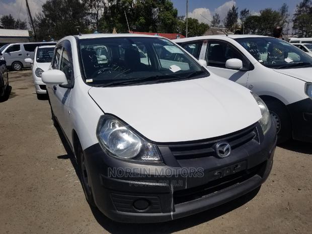 Pearl Edition Mazda Familia 2014: Reliable Used Car for Sale