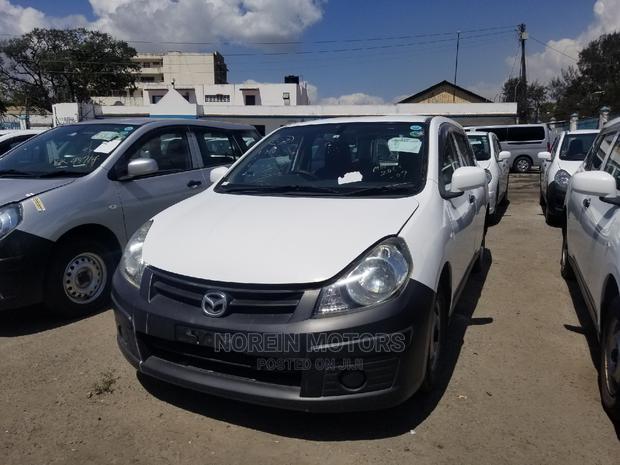 Pearl Edition Mazda Familia 2014: Reliable Used Car for Sale