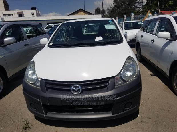 Pearl Edition Mazda Familia 2014: Reliable Used Car for Sale