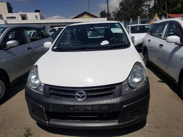 Pearl Edition Mazda Familia 2014: Reliable Used Car for Sale