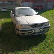 2000 Nissan FB15 in Silver: Perfect for Daily Commute for sale