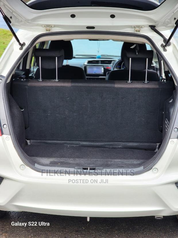 White 2015 Honda Fit - Compact Car with Exceptional Fuel Efficiency