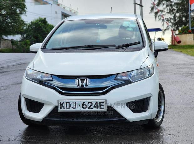 White 2015 Honda Fit - Compact Car with Exceptional Fuel Efficiency