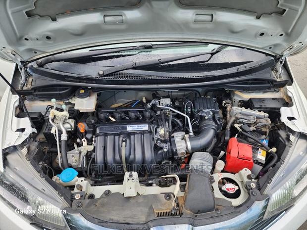 White 2015 Honda Fit - Compact Car with Exceptional Fuel Efficiency