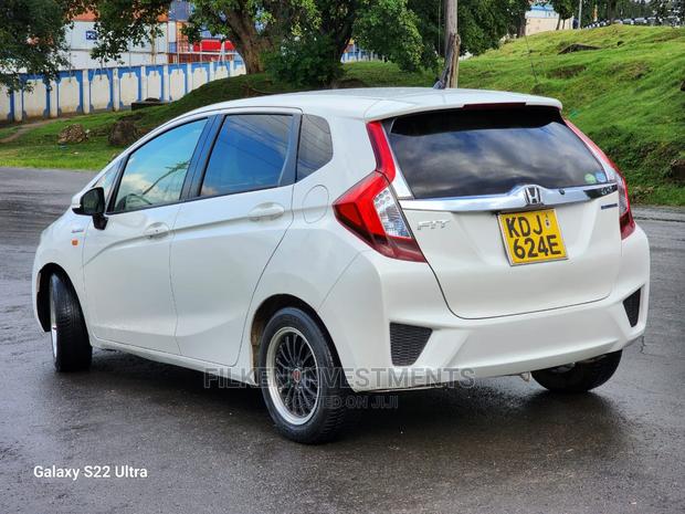 White 2015 Honda Fit - Compact Car with Exceptional Fuel Efficiency