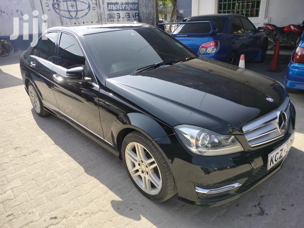 Pre-owned 2013 Mercedes-Benz C180 Black: Elegant Compact Car