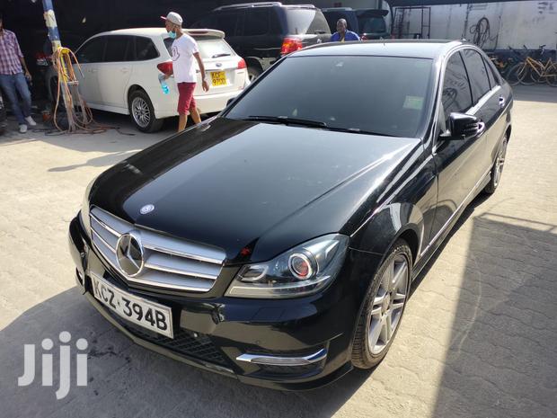 Pre-owned 2013 Mercedes-Benz C180 Black: Elegant Compact Car