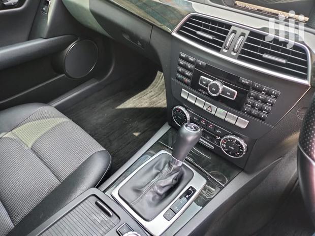 Pre-owned 2013 Mercedes-Benz C180 Black: Elegant Compact Car