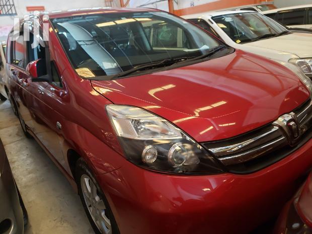 Red ISIS 2015 Toyota: High-Performance Compact Sedan