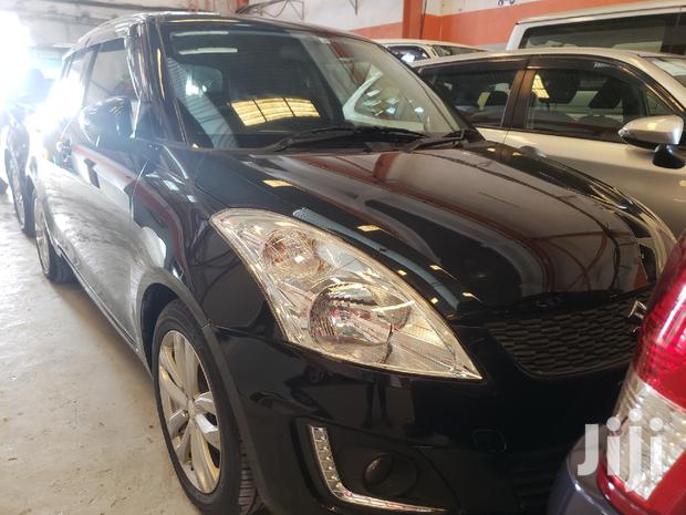Black 2015 Suzuki Swift: Compact Sedan with Modern Amenities