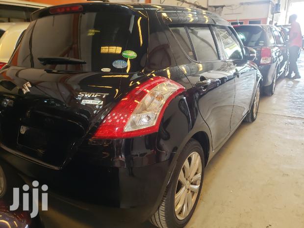 Black 2015 Suzuki Swift: Compact Sedan with Modern Amenities