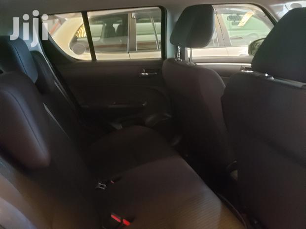 Black 2015 Suzuki Swift: Compact Sedan with Modern Amenities
