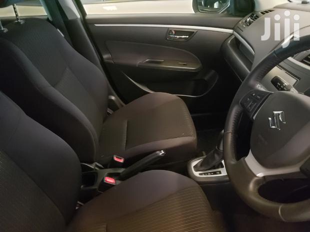 Black 2015 Suzuki Swift: Compact Sedan with Modern Amenities
