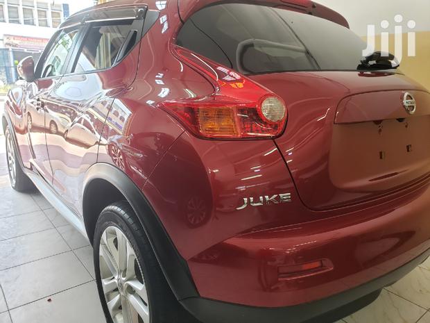 2014 Nissan Juke in Red: Elegant Compact SUV