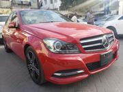Red 2014 C180 Mercedes-Benz: Like-New Pre-Owned Luxury Car for sale