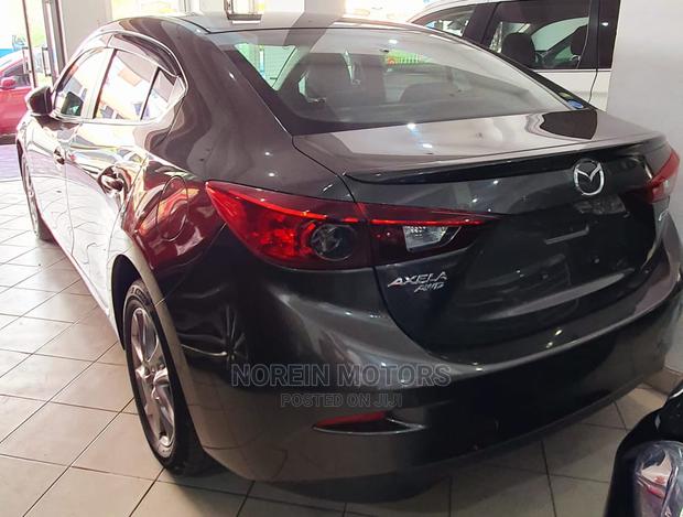 Drive the 2015 Mazda Axela Brown: Experience a New Level of Comfort