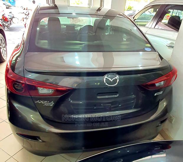 Drive the 2015 Mazda Axela Brown: Experience a New Level of Comfort