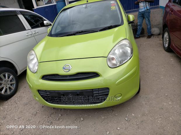 Eco-Friendly 2014 Nissan March Green: Compact Car for Modern Drivers