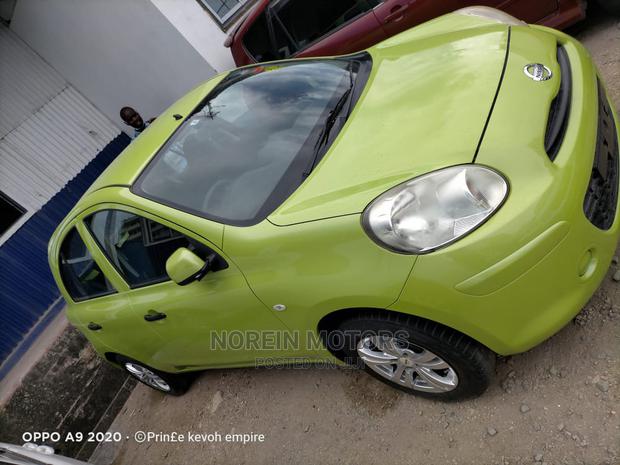 Eco-Friendly 2014 Nissan March Green: Compact Car for Modern Drivers