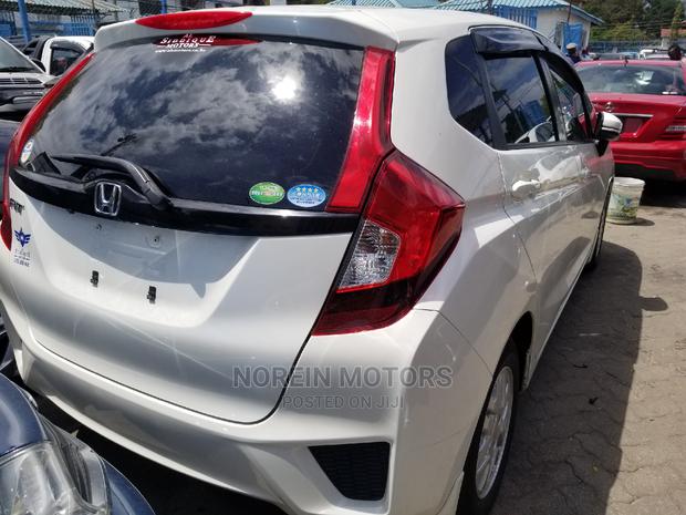 White Honda Fit 2015: Economical and Eco-friendly!