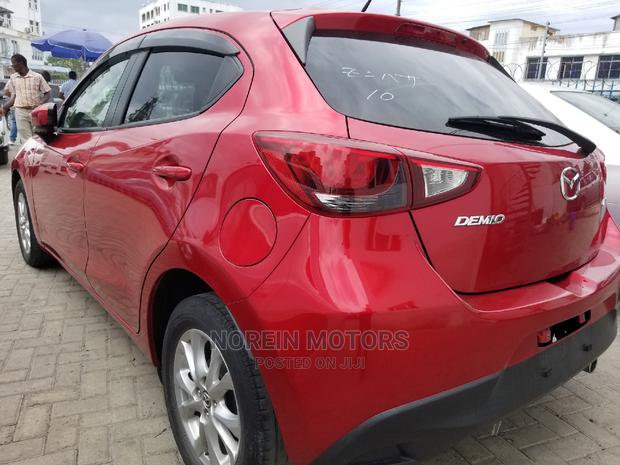 Red Mazda Demio 2015 - Modern Compact Car with Style and Performance