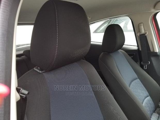 Red Mazda Demio 2015 - Modern Compact Car with Style and Performance