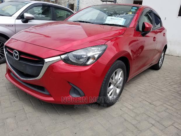 Red Mazda Demio 2015 - Modern Compact Car with Style and Performance