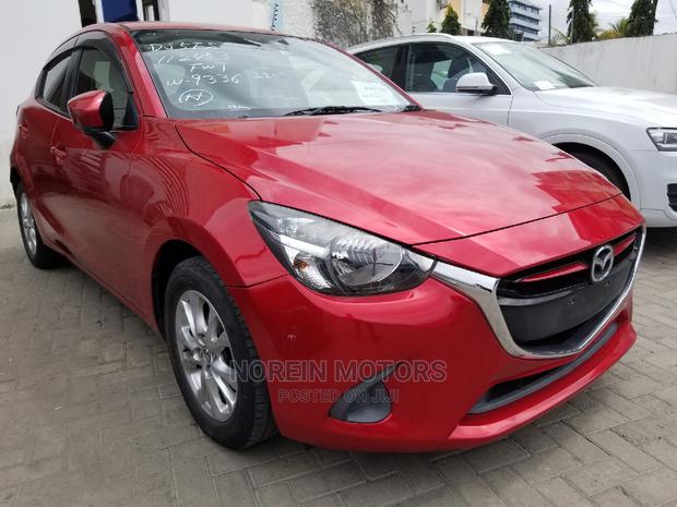 Red Mazda Demio 2015 - Modern Compact Car with Style and Performance