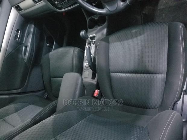 White Mitsubishi Outlander 2015 - Affordable and Spacious SUV