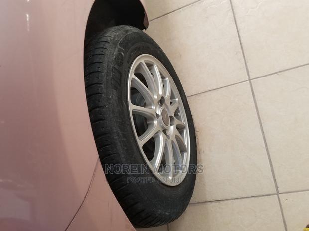 2014 Nissan March Pink - Charming Compact Vehicle for Sale