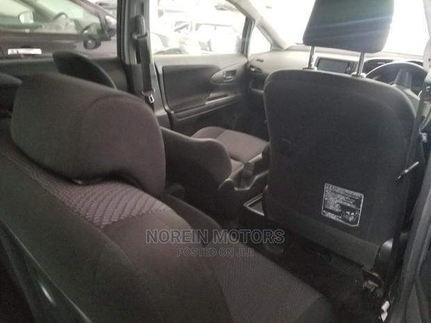 Purple 2015 Toyota Wish: Spacious, Comfortable, and Stylish Sedan