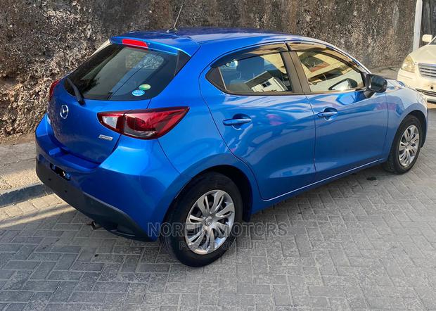 Blue 2015 Mazda Demio - Compact Car with Modern Design and Affordability