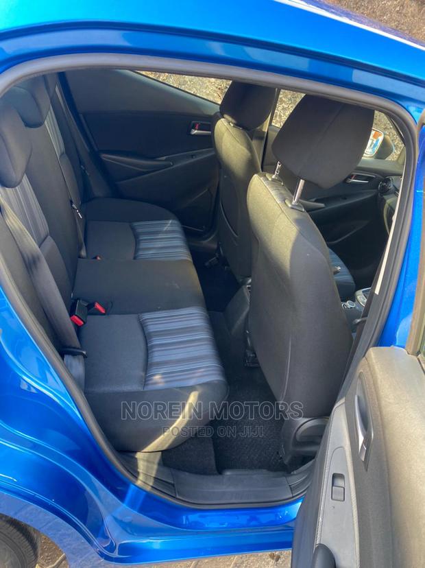 Blue 2015 Mazda Demio - Compact Car with Modern Design and Affordability