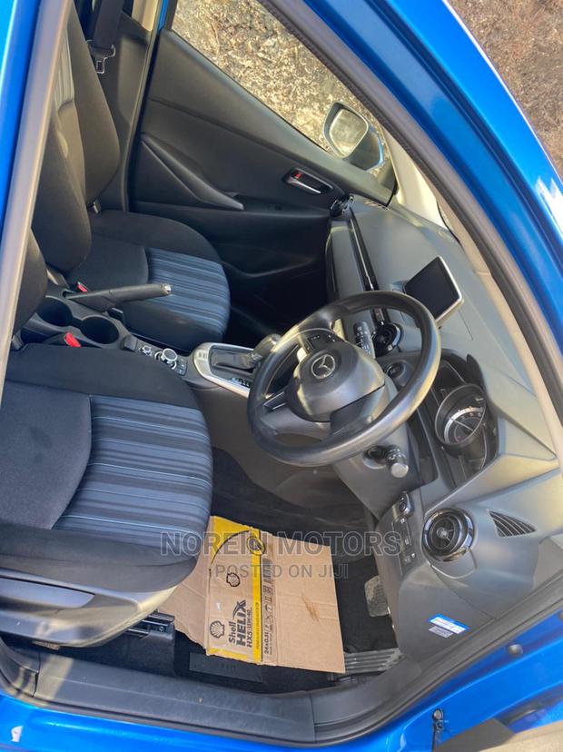 Blue 2015 Mazda Demio - Compact Car with Modern Design and Affordability
