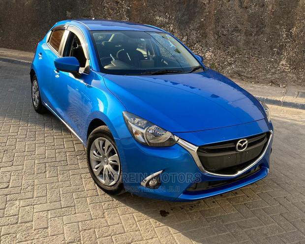 Blue 2015 Mazda Demio - Compact Car with Modern Design and Affordability