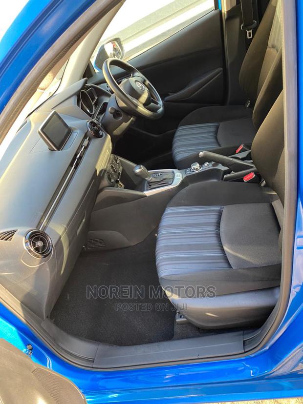 Blue 2015 Mazda Demio - Compact Car with Modern Design and Affordability