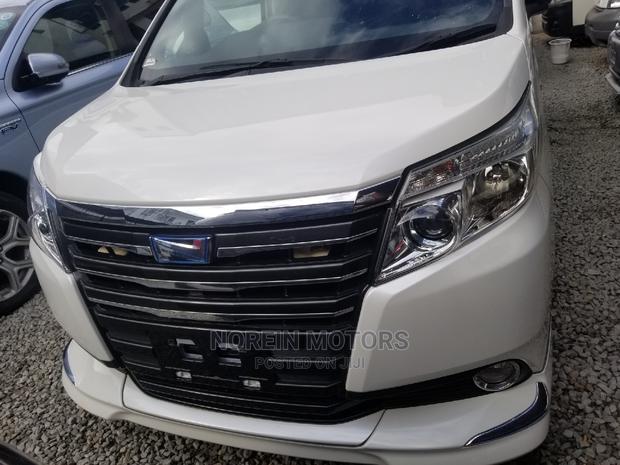 White 2015 Toyota Noah: Comfortable and Efficient Minivan