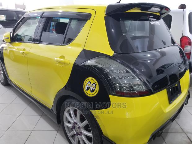 Yellow 2015 Suzuki Swift - Stylish Compact Car Available