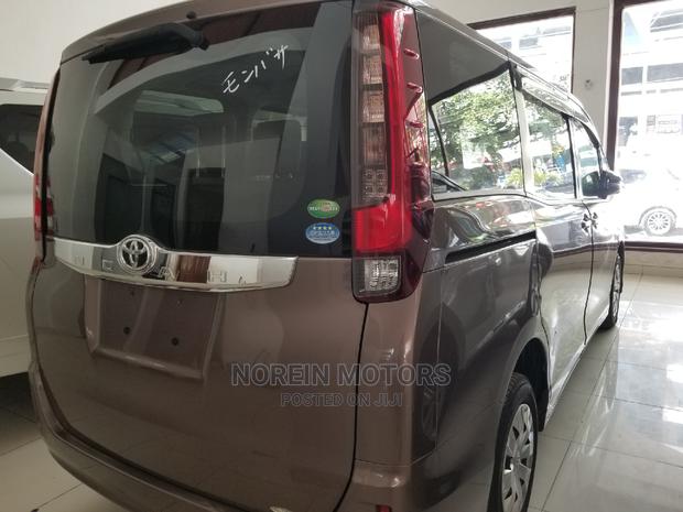 2015 Brown Noah Toyota: Affordable and Spacious Family-Friendly Minivan