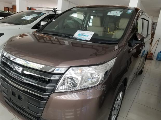 2015 Brown Noah Toyota: Affordable and Spacious Family-Friendly Minivan