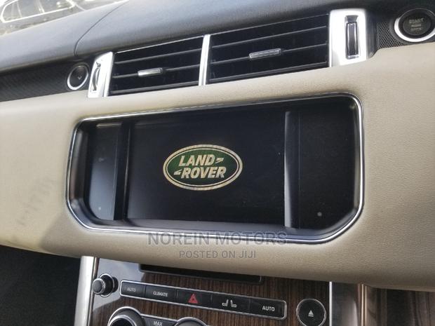 Experience the power and style of a 2016 Land Rover Range Rover Sport in Red. Perfect for off-road adventures. Contact us