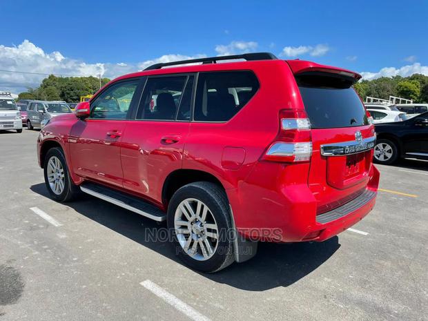 Red 2015 Toyota Land Cruiser Prado: Powerful Off-Road Vehicle