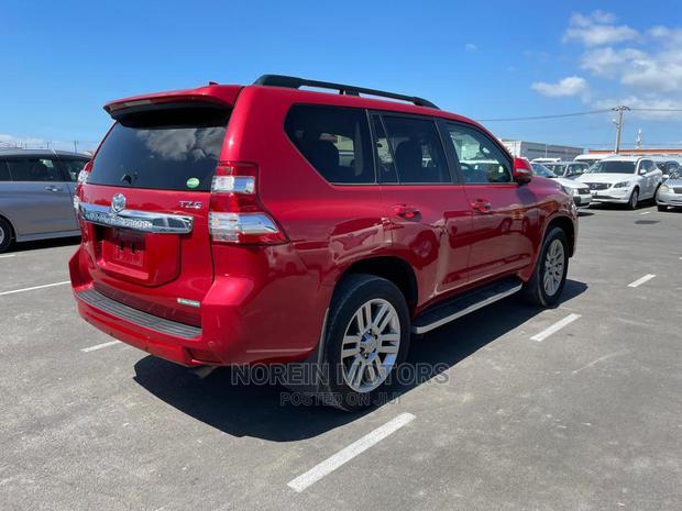 Red 2015 Toyota Land Cruiser Prado: Powerful Off-Road Vehicle