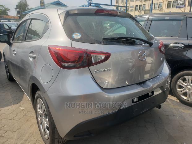 Gray Mazda Demio 2015 - Reliable Compact Car for Sale