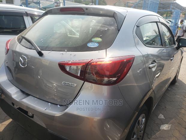 Gray Mazda Demio 2015 - Reliable Compact Car for Sale