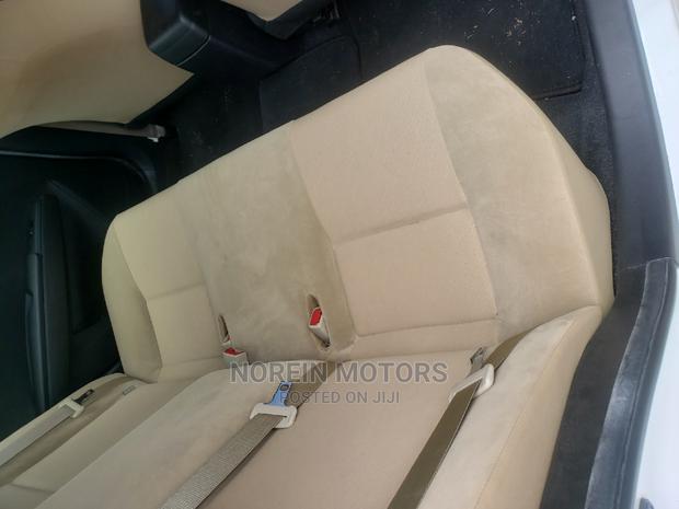 2015 Toyota Axio Off-White: Compact Sedan with Elegance