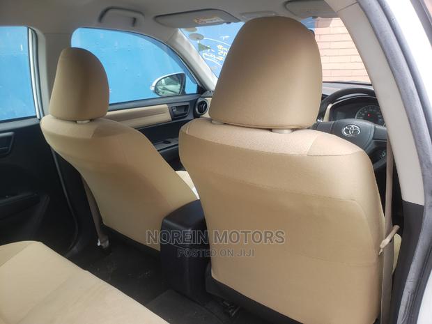 2015 Toyota Axio Off-White: Compact Sedan with Elegance