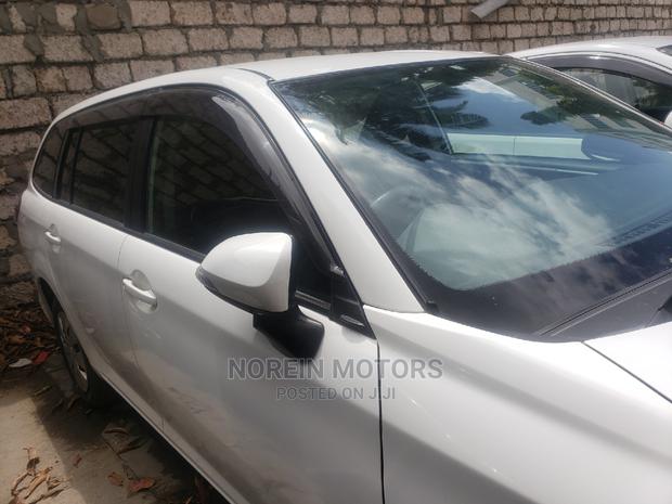 Experience luxury in the 2015 Toyota Fielder Corolla Pearl, a spacious