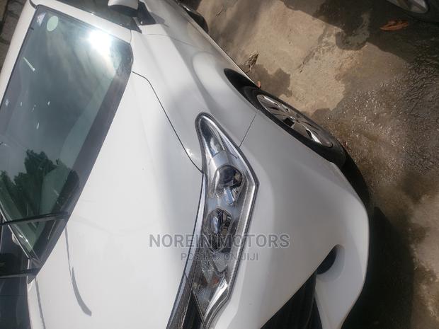 Experience luxury in the 2015 Toyota Fielder Corolla Pearl, a spacious