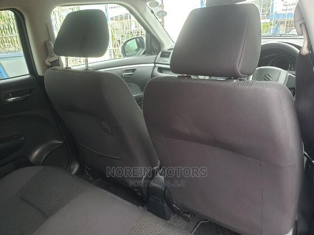 Teal 2015 Suzuki Swift - Pre-owned Compact Vehicle